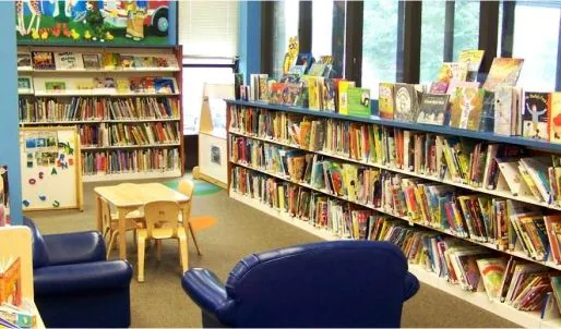 The DWPS library, with shelves of books and study seating